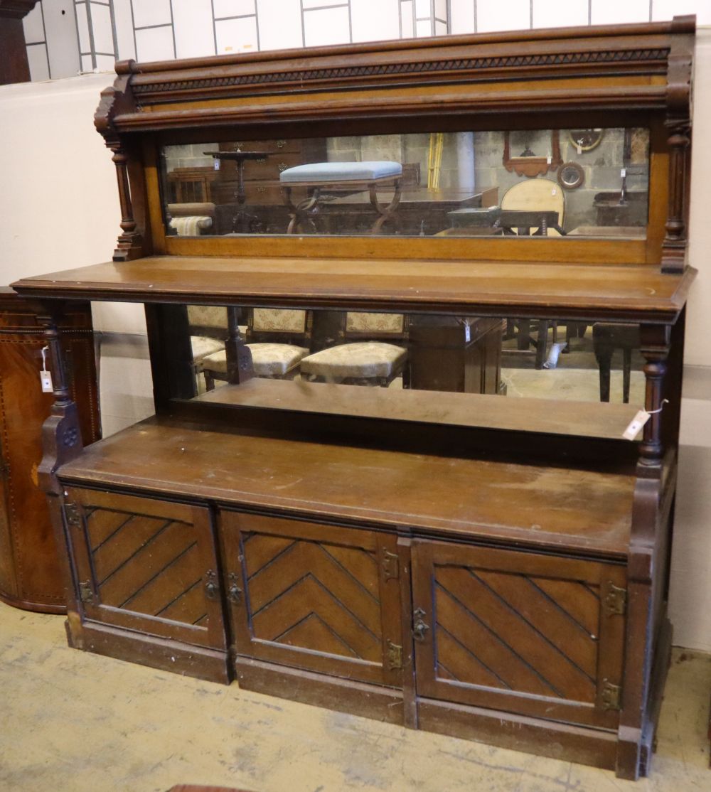 A large late Victorian oak aesthetic movement buffet sideboard, width 183cm depth 58cm height 180cm